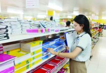 Julia Joy Salcedo of the Department of Trade and Industry Antique monitors the prices of school materials in a major store in San Jose de Buenavista on Monday, Aug. 14. PNA PHOTO COURTESY OF DTI ANTIQUE