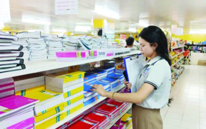 DTI_Antique_resized Julia Joy Salcedo of the Department of Trade and Industry Antique monitors the prices of school materials in a major store in San Jose de Buenavista on Monday, Aug. 14. PNA PHOTO COURTESY OF DTI ANTIQUE