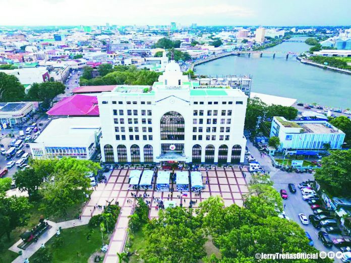 banner_pic_resized PROGRESSIVE ILOILO CITY. This drone shot of Iloilo City's landscape depicts how far the city has gone from 86 years ago. As it continues to push forward, the city is clearly on the track towards becoming one of the Top 3 Most Competitive Highly Urbanized Cities in the Philippines by 2028. ILOILO CITY MAYOR’S OFFICE PHOTO