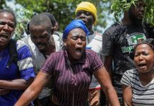 Haitians flee homes as gang violence surges in capital Haiti residents gather outside a military base demanding help. REUTERS