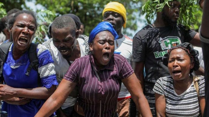 haiti_resized Haiti residents gather outside a military base demanding help. REUTERS