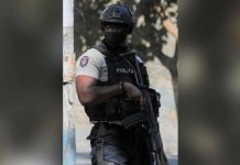 Haiti gang opens fire on protesters in capital, killing 7 A police officer stands guard near a site where alleged gang members were set on fire by a crowd of people in Port-au-Prince, Haiti. REUTERS