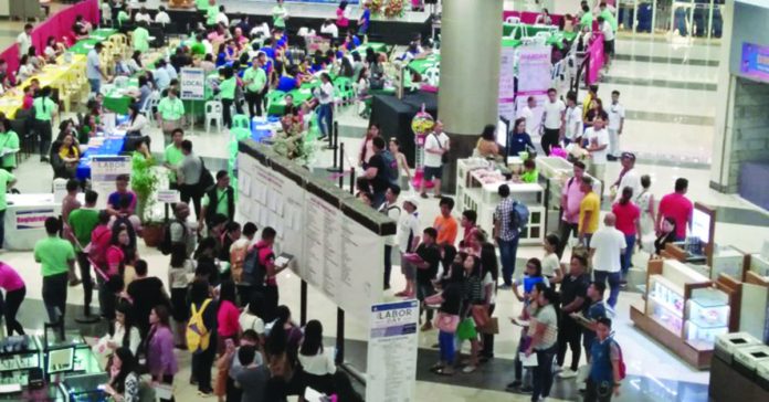 job_fair_pic_resized Job seekers flock at the job fair held at the Robinsons Place Jaro in Iloilo City in this file photo. PNA PHOTO BY PERLA LENA