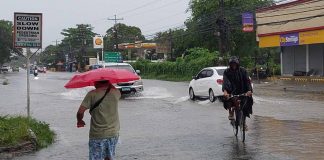 Floodwaters cover this portion of the National Highway in Leganes, Iloilo.