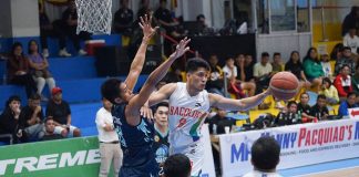 Bacolod City of Smiles’ Domark Matillano looks to pass the ball after being met by the defense of Batangas City Embassy Chill’s Rhaffy Octobre. MPBL PHOTO