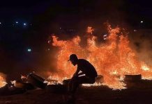 Libyans protest contact with Israel Tires were burnt in the capital Tripoli as a form of protest. EPA