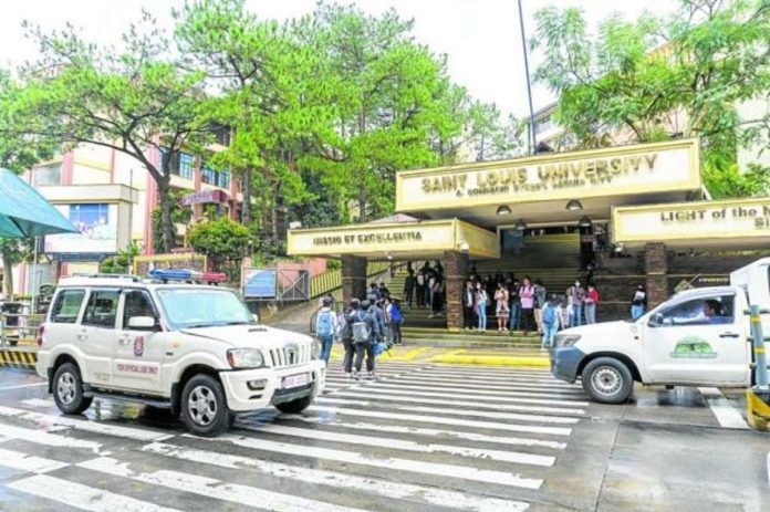 school_resized POLICE VISIBILITY. A patrol car passes by the main gate of Saint Louis University in Baguio City as police intensify their security monitoring of local schools, including the University of the Philippines-Baguio, due to the recent Red-tagging of students. INQUIRER FILE PHOTO TAKEN BY NEIL CLARK ONGCHANGCO