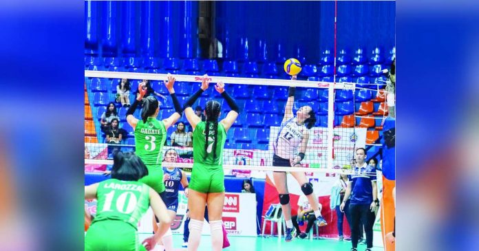 sports adamson_superimposed Adamson University Lady Falcons’ Lucille Almonte finds a hole in the defense of the De La Salle University Lady Spikers for a drop shot. SHAKEY’S PHOTO