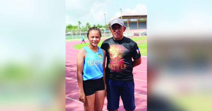 sports negrense_superimposed Negrense jumper Bianca Juliana Seroy with head coach Amado Juguan. CONTRIBUTED PHOTO