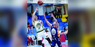 Negros Pau Muscovados’ Camillus Altamirano throws the drop shot against the defense of Bicol Volcanoes’ Necky Rifarial. MPBL PHOTO
