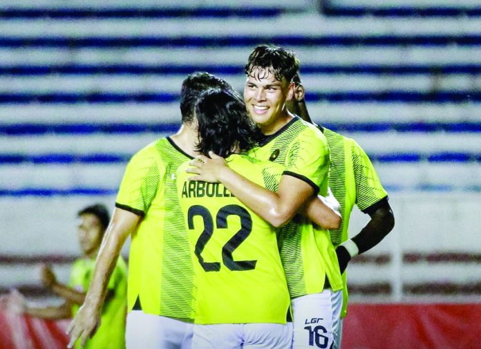 sports_kaya_resized Kaya-Iloilo FC newcomer Justin Baas (16) is hugged by teammate Fitch Arboleda after knocking in a goal early in the second half against Loyola FC. KAYA-ILOILO PHOTO
