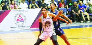 Negros Pau Muscovados’ Jason Melano battles Batangas City Embassy Chill’s Rhaffy Octobre for rebound. MPBL PHOTO