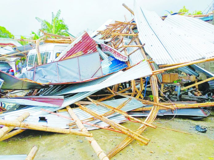 tornado_resized Two workers were hurt, and nine cars were damaged when a tornado ripped through Barangay Tagbak, Jaro, Iloilo City yesterday morning, Aug. 30. AJ PALCULLO/PN