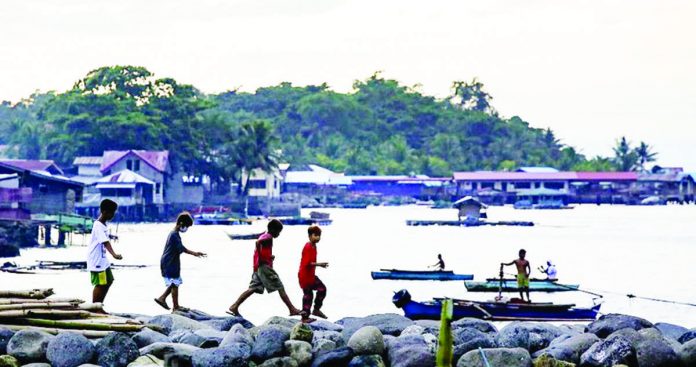 Twenty-nine human trafficking victims were recorded in Western Visayas as of June 30 this year. Of the number, 12 were victims of forced labor while six were victims of online sexual abuse and exploitation of children. Photo shows children playing at the breakwater. GEORGE CALVELO/ABS-CBN NEWS PHOTO