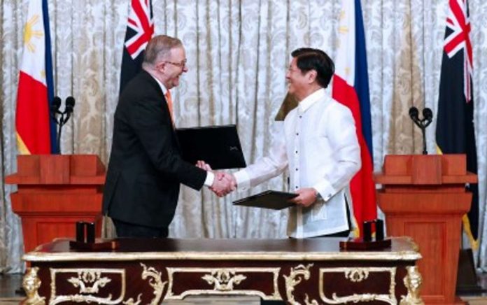 Australia_visa_resized President Ferdinand R. Marcos Jr. and Australian Prime Minister Anthony Albanese shake hands after the signing of the Joint Declaration on Strategic Partnership after their bilateral meeting held at the Reception Hall of Malacañan Palace on Sept. 8, 2023. Under the memorandum of understanding, the Philippines and Australia will grant eligible participants from both countries “Work and Holiday” visa, which will permit them to stay and work in the host country for a period of 12 months. PNA PHOTO BY REY BANIQUET