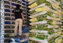 BOC discovers P400-M imported rice, other goods in Manila A Customs officer inspects imported rice found in an inspection of three warehouses in Tondo, Manila on Sept. 16. The Bureau of Customs (BOC) on Monday, Sept. 18, said a total of 36,086 sacks of imported rice from Vietnam, Thailand, and Myanmar worth P90.2 million and miscellaneous goods worth P310 million were found during the inspection. BOC PHOTO