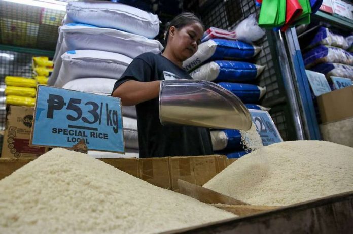 A vendor tends to her stall selling rice at the Kamuning Market in Quezon City. JONATHAN CELLONA/ABS-CBN NEWS PHOTO