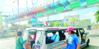 The Land Transportation Franchising and Regulatory Board reminds public utility vehicle operators and drivers that fines await those who use the fuel subsidy card to withdraw cash or pay for goods other than fuel. Photo shows passengers boarding a jeepney on Sen. Benigno Aquino Jr. Avenue in Mandurriao, Iloilo City. AJ PALCULLO/PN