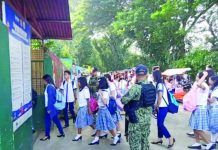 Personnel of the Bago City Police Station help ensure the safety of learners of the Bago City Elementary School as they go back to school on Monday, Sept. 4. SCREENGRAB FROM BAGO COMPONENT CITY POLICE STATION VIDEO