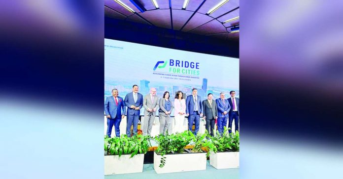 banner pic_superimposed PH REPRESENTATIVE. Iloilo City’s Mayor Jerry Treñas (third from right) is shown here with top local government executives from Germany, the United Kingdom, Slovenia, Armenia, Malawi, Cambodia, Jordan, and the Kyrgyz Republic. They served as panelists at the United Nations Industrial Development Organization’s Bridge for Cities forum on Sept. 5, 2023 in Vienna, Austria. Treñas, the lone local chief executive from the Philippines, highlighted the city’s programs and projects reducing carbon emissions and other climate initiatives.