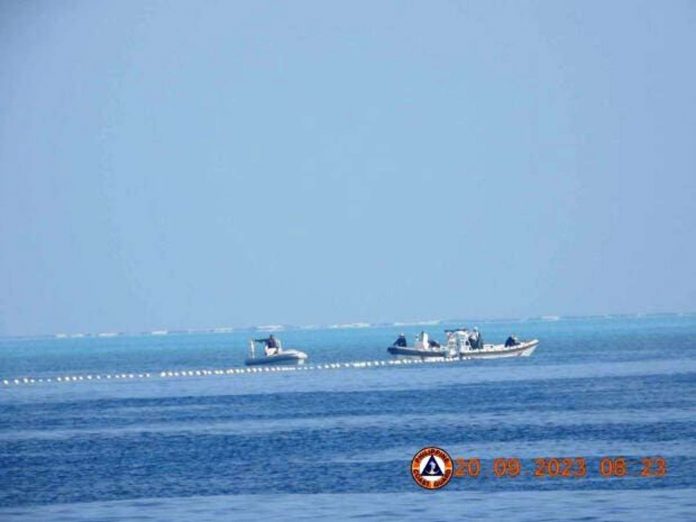 china_resized Chinese Coast Guard boats close to the floating barrier are pictured on Sept. 20, 2023, near the Scarborough Shoal in the South China Sea, in this handout image released by the Philippine Coast Guard on Sept. 24, 2023. PHILIPPINE COAST GUARD/HANDOUT VIA REUTERS
