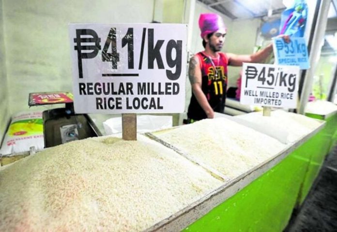 lifted_resized A vendor in Sta. Ana, Manila, follows the government-mandated price ceiling for regular- and well-milled rice, set at P41 and P45 a kilo, respectively. The government says imposing the cap is a temporary measure to temper the rising prices of rice. MARIANNE BERMUDEZ, PHILIPPINE DAILY INQUIRER