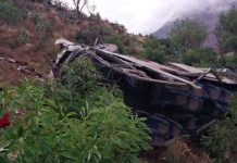 A handout photo made available by Agencia Andina shows the wreckage of a bus that fell into a ravine in Huaccoto, Churcampa province, Peru. The coach plunged some 200 meters from a mountain road. EPA