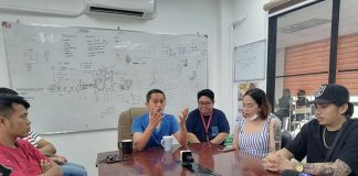 Jeck Conlu, the head of the Public Safety and Transportation Management Office, mediates between taxi passenger Lhyssa Calamaan (second from the right, in a dress) and taxi driver Ronald Gape (leftmost, crossing his arms). ILOILO CITY PIO/PSTMO PHOTO