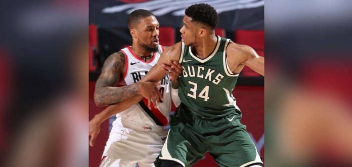 sports lillard_superimposed Damian Lillard and Giannis Antetokounmpo are now teammates at the Milwaukee Bucks. GETTY IMAGES