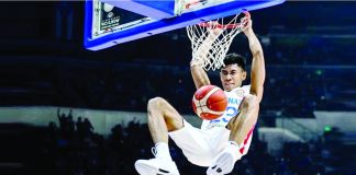 Gilas Pilipinas’ Rhenz Abando hangs in the ring for a two-handed dunk during their 96-75 win over China in the 2023 FIBA Basketball World Cup on Saturday night. FIBA PHOTO