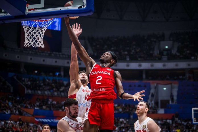 sports_gilgeous_resized Canada’s Shai Gilgeous-Alexander attacks the Spain defense for an inside hit. FIBA PHOTO