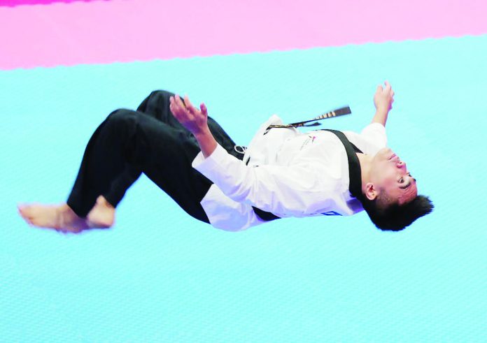 sports_taekwondo_resized King Patrick Perez performs during the 19th Asian Games on Sunday. PHOTO COURTESY OF POC