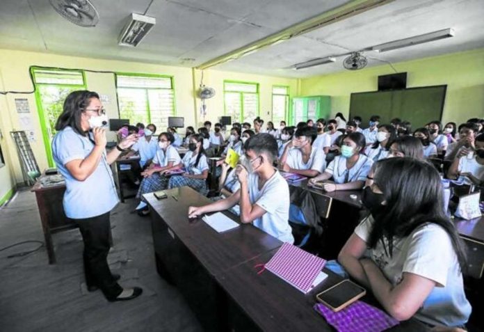 students_resized A teacher holds an in-person class for students of Navotas National High School in this photo taken in November 2022. The Department of Education is reviewing its K-12 curriculum as it aims to train more job-ready graduates. FILE PHOTO BY LYN RILLON / PHILIPPINE DAILY INQUIRER