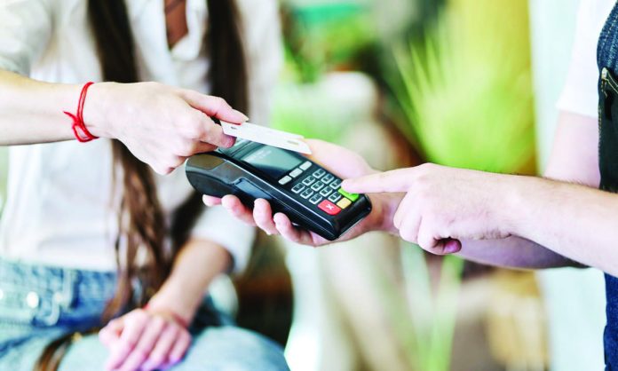 card_spending_resized The Bangko Sentral ng Pilipinas says Filipinos are now getting used to cashless payments. PHOTO COURTESY OF GETTY IMAGES/NERDWALLET.COM