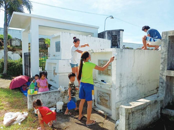 cemetery_pic_resized The Department of Health advises the public not to bring small children to cemeteries to keep them from getting injuries and catching diseases from overcrowding. Photo shows family members, including children, cleaning and painting the tombs of their departed loved ones at the Jaro Catholic Cemetery in Jaro, Iloilo City. AJ PALCULLO/PN