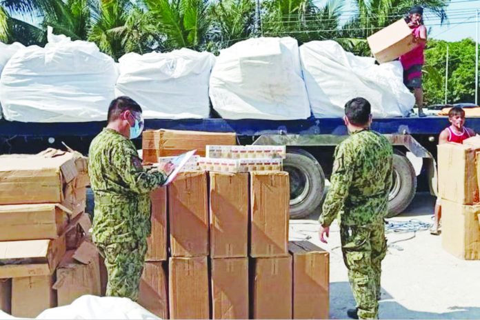 cig_traders.JPG_resized Police seized around P9 million worth of counterfeit cigarettes in Limay, Bataan in this file photo. POLICE REGIONAL OFFICE 3 PHOTO