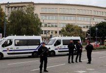 France raises security level after school knife attack Policemen guard a school in Arras after the attack. REUTERS