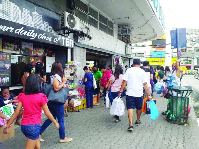 front_pic_resized The proposed wage increase in Western Visayas has seen little resistance from the local business community. Photo shows the busy J.M. Basa Street in Iloilo City’s downtown area. PN FILE PHOTO