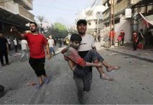 Gaza Strip sees heaviest Israeli bombardment since start of war A Palestinian man carries a wounded boy following an Israeli air strike in northern Gaza. EPA