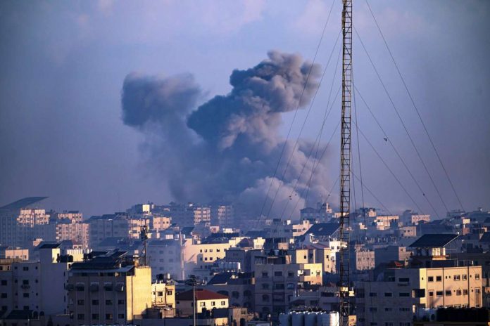 Smoke rises following an Israeli airstrike in Gaza City. Israel’s retaliation has escalated after Gaza’s militant Hamas rulers launched an unprecedented attack on Israel Saturday, killing over 1,200 Israelis and taking captive dozens. Heavy Israeli airstrikes on the enclave has killed over 1,200 Palestinians. AP PHOTO/FATIMA SHBAIR