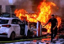 Israel conducts targeted raid in northern Gaza Strip A Palestinian man runs away from a burning building in the Gaza Strip that Israel has struck with missiles. BBC