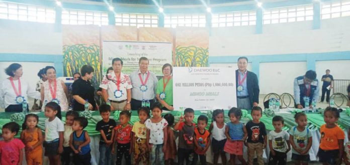 malnourished_kids_resized Former senator Franklin Drilon (third from right), Mayor Francisco Calvo of Calinog (fourth from right), NVC Foundation Inc. president Millie Kilakyo (second from right), and officials from Daewoo Philippines during the ceremonial turnover of Mingo Meals.