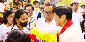 President Ferdinand R. Marcos Jr. hands over a sack of premium rice to a beneficiary of the Pantawid Pamilyang Pilipino Program in San Jose de Buenavista, Antique on Friday, Oct. 6. The President also led the distribution of various forms of government assistance in the province. REY BANIQUET/NIB-PNA PHOTO