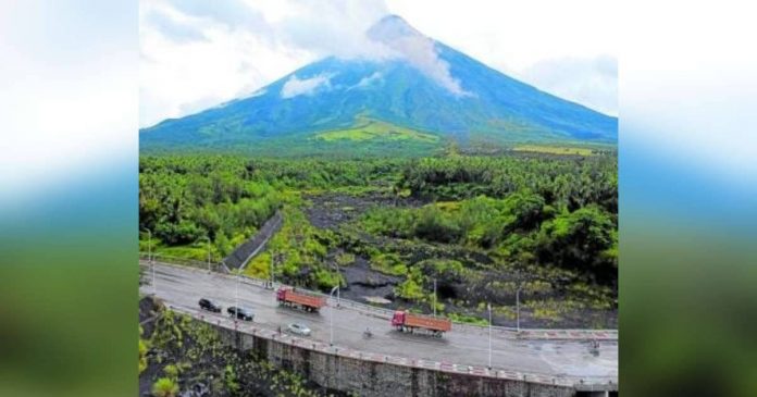 mayon_superimposed Villages in areas identified as high-risk for lahar from Mayon Volcano are advised to be ready, especially during the typhoon season, as heavy and continuous rains may generate lahar flows along significant channels. This image of Mayon was taken from Barangay Mabinit in Legazpi City on July 21, 2023. MARK ALVIC ESPLANA, PHILIPPINE DAILY INQUIRER