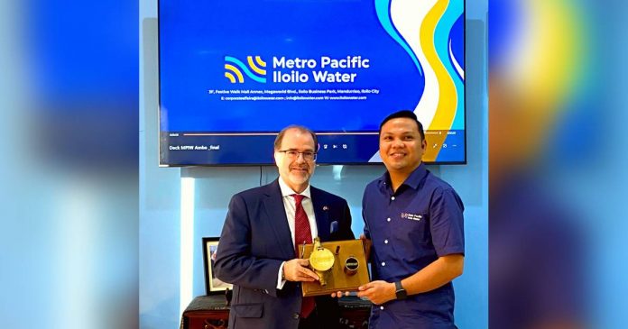 metro-pacific-iloilo-water Canadian Ambassador David Bruce Hartman (left) visits Metro Pacific Iloilo Water in Iloilo City. Welcoming him is Robert Cabiles, the Chief Operations Officer of the water firm.
