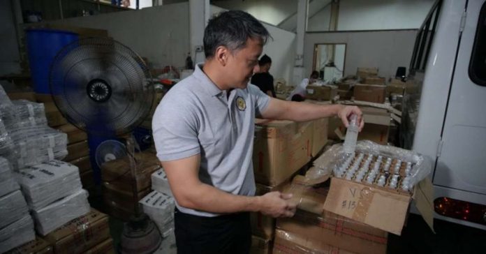 perfume_bottles_resized Bureau of Internal Revenue (BIR) commissioner Romeo Lumagui Jr. leads the nationwide raid of excisable perfume and toilet water products on Sept. 27 and 28. BIR seized almost 400,000 bottles of perfume and toilet water from over 400 firms with P604.3 million in tax liabilities. BIR PHOTO