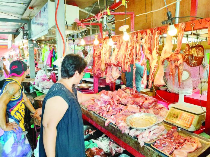 pork_import_resized Pork cuts are on sale at a public market in Iloilo. The Department of Agriculture says demand for pork increases during the holidays. PN PHOTO