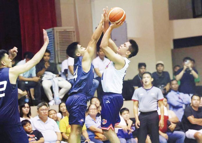 rain-or-shine Rain or Shine Elasto Painters’ Rey Nambatac attempts to score against the defense of Meralco Bolts’ Diego Dario. PBA PHOTO