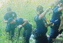 2 suspected rebels killed in E.B. Magalona clash Two suspected members of the New People’s Army Northern Negros Front, Komiteng Rehiyon - Negros, Cebu, Bohol, Siquijor were killed in a clash with troops of the Philippine Army’s 79th Infantry Battalion in Barangay Canlusong, E.B. Magalona, Negros Occidental on Tuesday, Oct. 17. Photo shows the Scene of the Crime Operatives inspecting the body of one of the fatalities. 79TH INFANTRY BATTALION PHOTO
