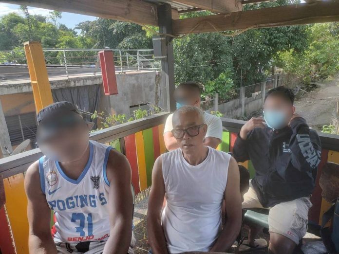 scam victims (blur faces except person in center) Bienvenido Berja Jr. (center), father of one of the police recruitment scam victims. MAE SINGUAY/PN